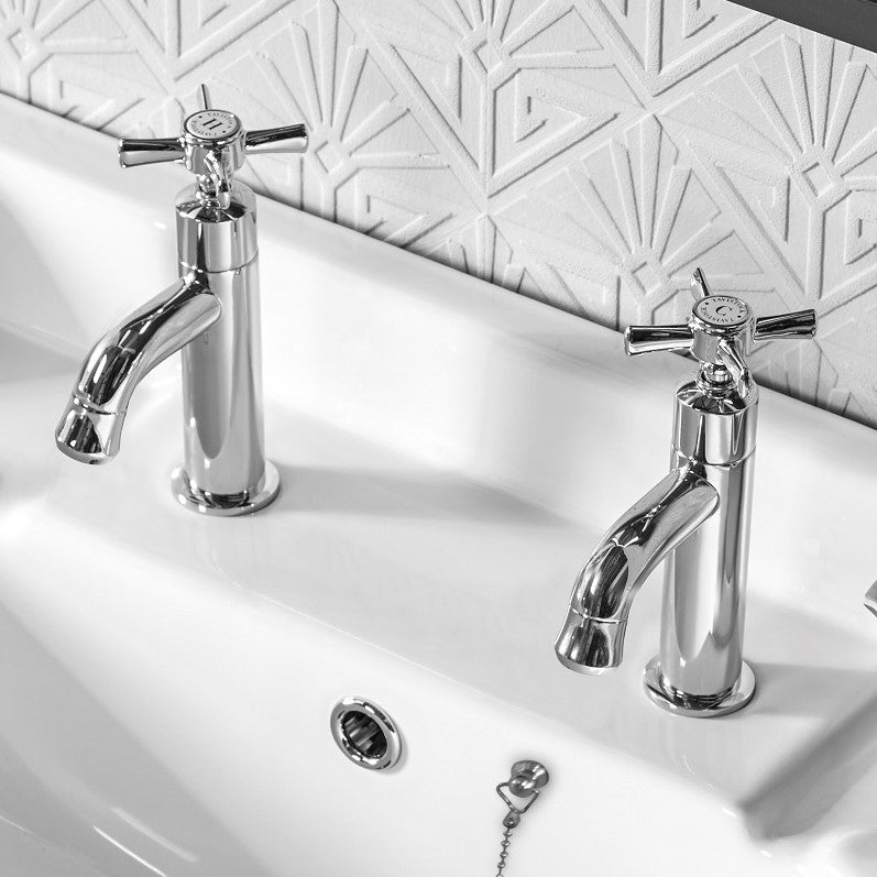 Tavistock Cheltenham Basin Taps (Pairs) - Chrome close up view of basin with wallpaper design behind TCM70