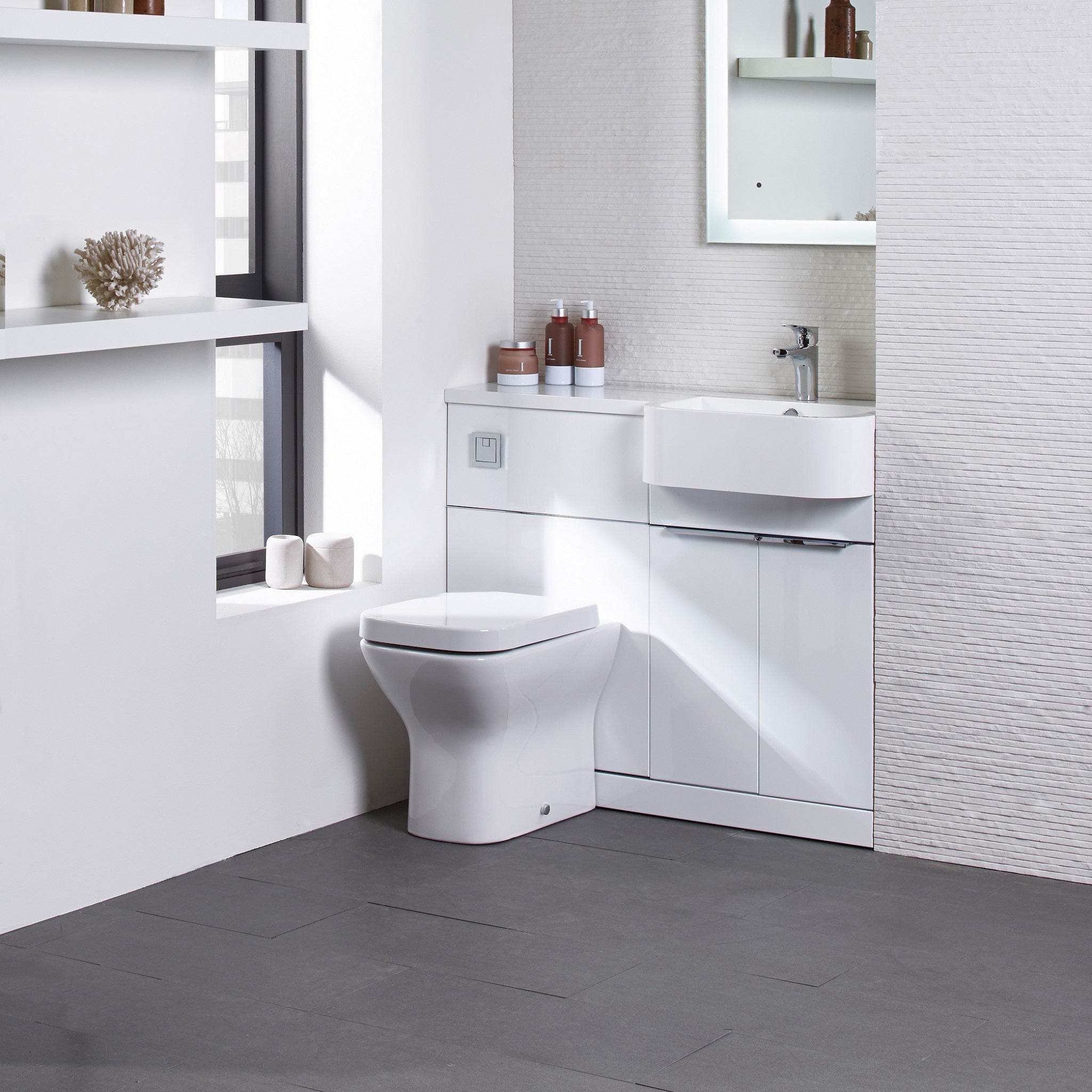 Tavistock Match 1200mm Combination Unit - White Gloss (L or R Hand) against white wall paper underneath light up mirror MAT12RW