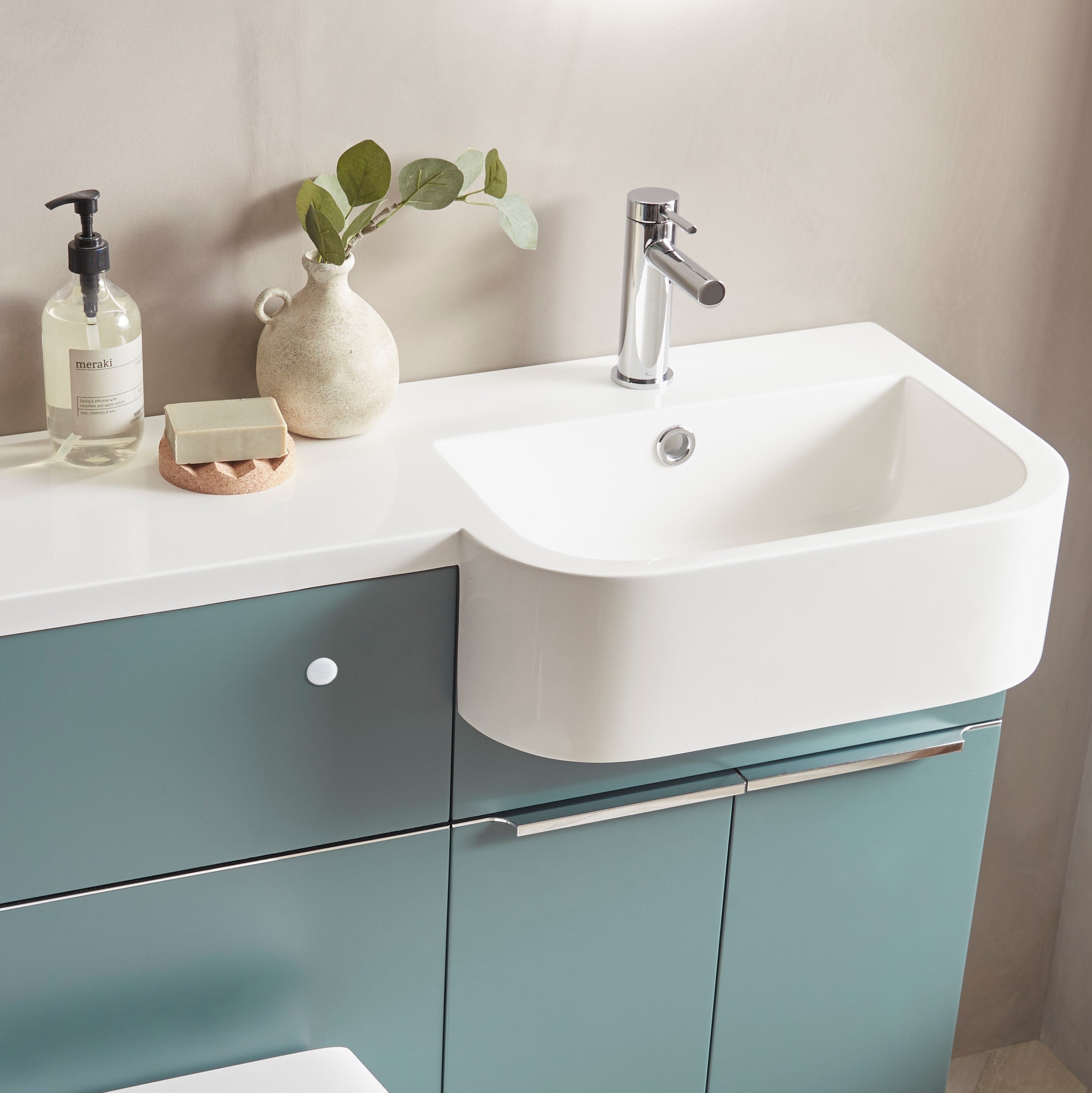 Tavistock Match 1000mm Combination Unit - Viridian Green (L or R Hand) close up view of basin on the unit against the a pal painted wall MATRVRG