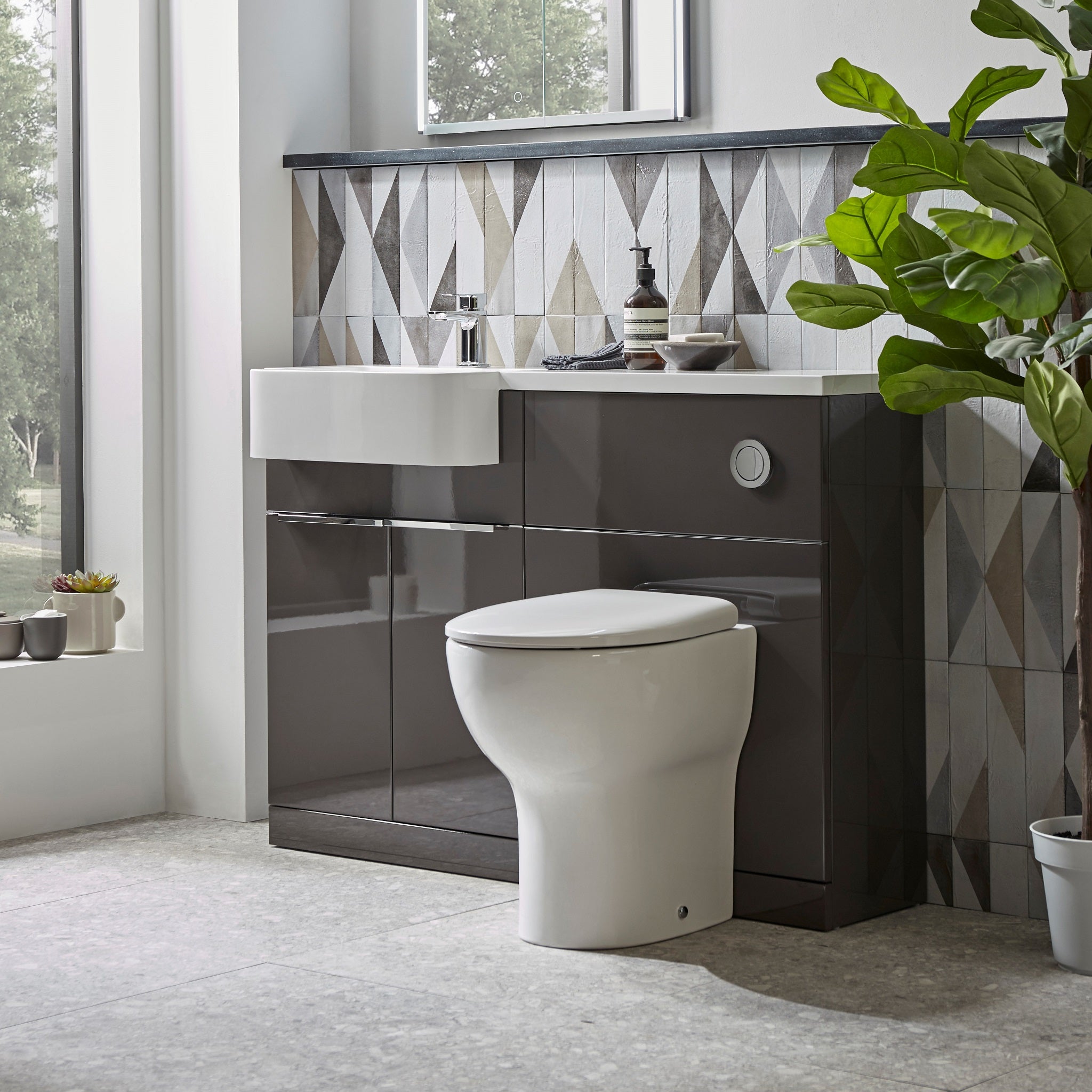 Tavistock Match 1000mm Combination Unit - Gloss Clay (L or R Hand) against tiled design plant fading off the right side MATRC