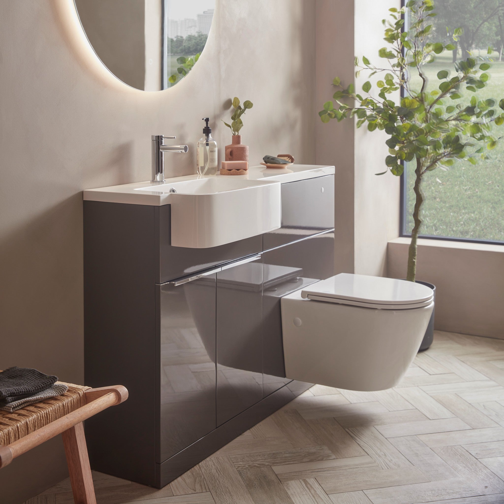 Tavistock Match 1200mm Combination Unit - Gloss Clay (L or R Hand) against pal wall underneath a light up mirror MAT12LC