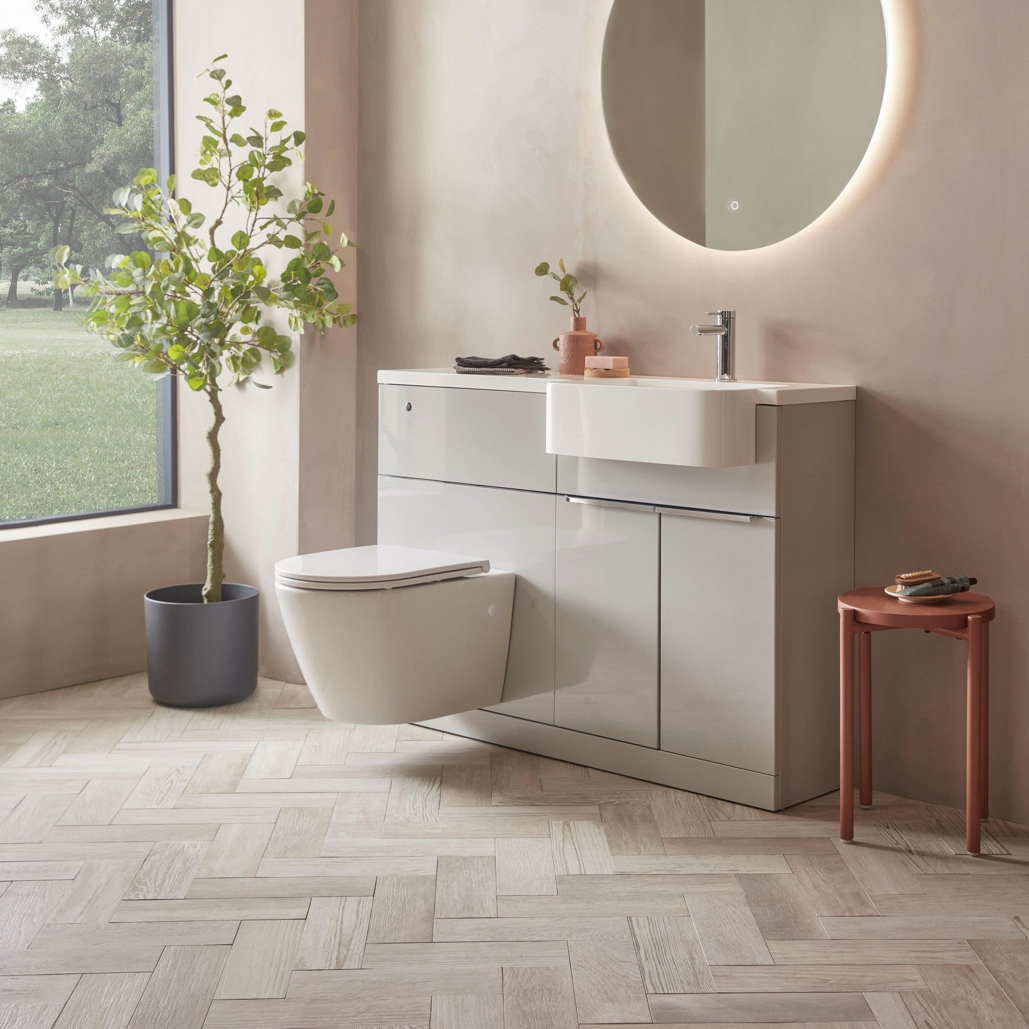 Tavistock Match 1200mm Combination Unit - Gloss Light Grey (L or R Hand) against pal painted wall underneath a light up mirror MAT12RG