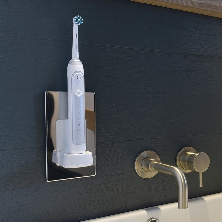 ProofVision In-Wall Electric Toothbrush Charger (Oral B & Braun) against wood tiles above basin PV10-PS-FR