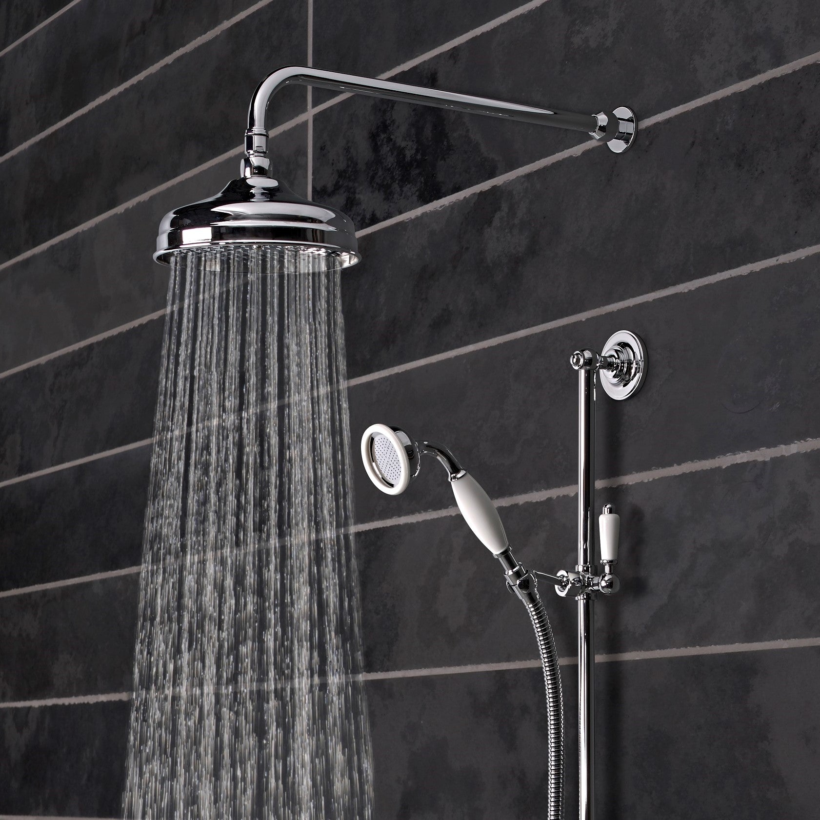 Tavistock Varsity Concealed Dual Function Diverter System - Chrome close up view of both shower heads against dark grey tiling SVA1615