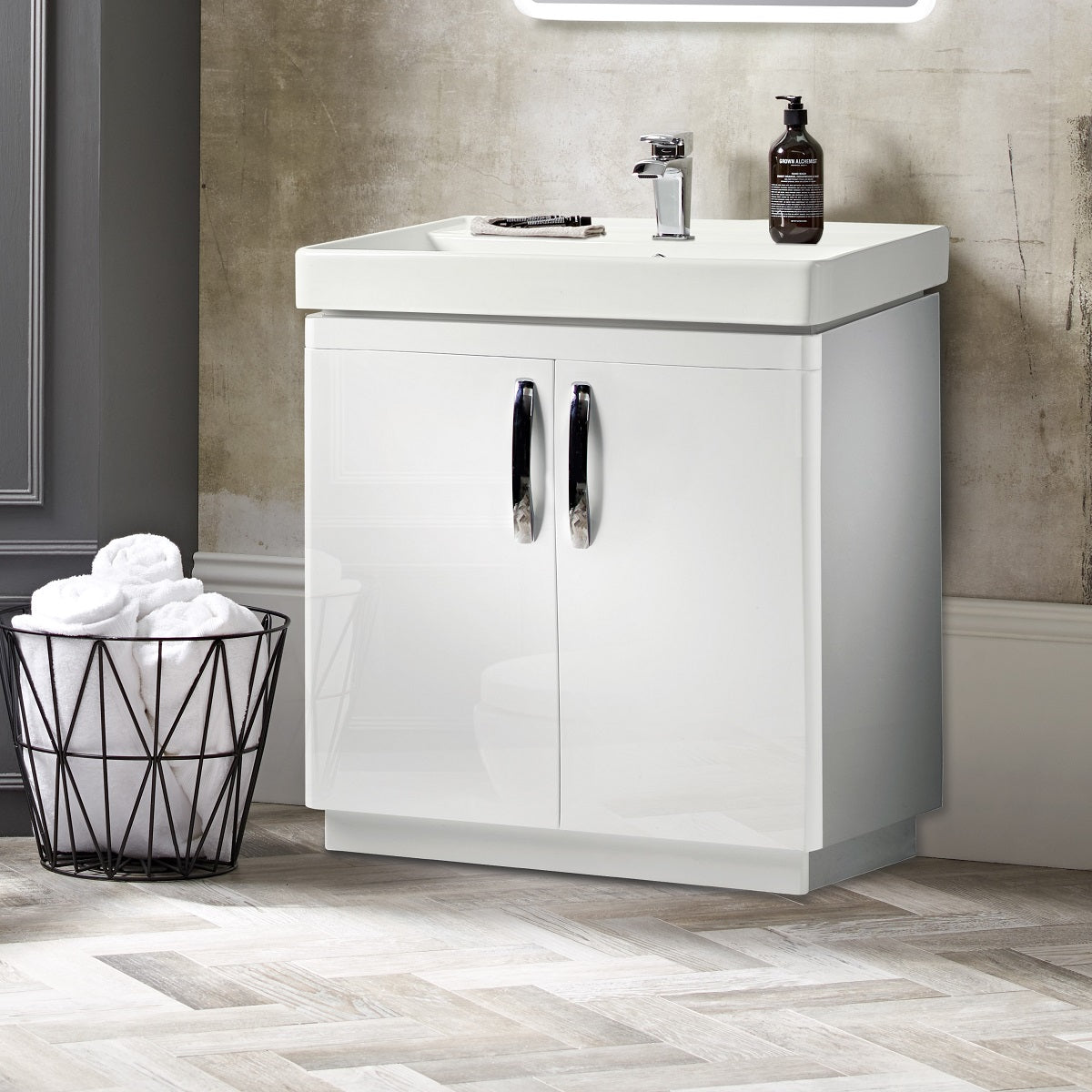 Tavistock Compass 800mm Floor reaching Unit & Basin - Various Colours against wallpaper design with basket next to unit/basin