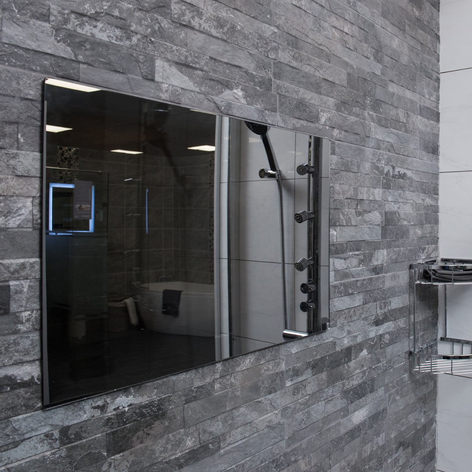 ProofVision 24inch Premium Bathroom Smart TV against stoned wall in grey tones PV24MF-A
