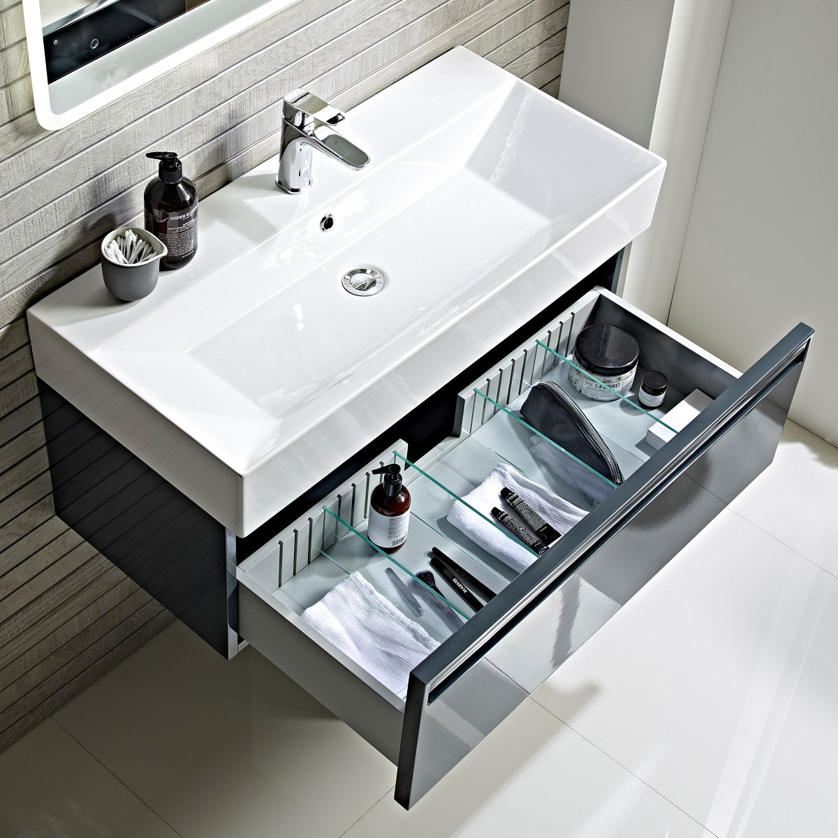 Tavistock Forum 600mm Wall Mounted Unit & Basin - Various Colours open door top view against wooden wall underneath a mirror FR90WOB