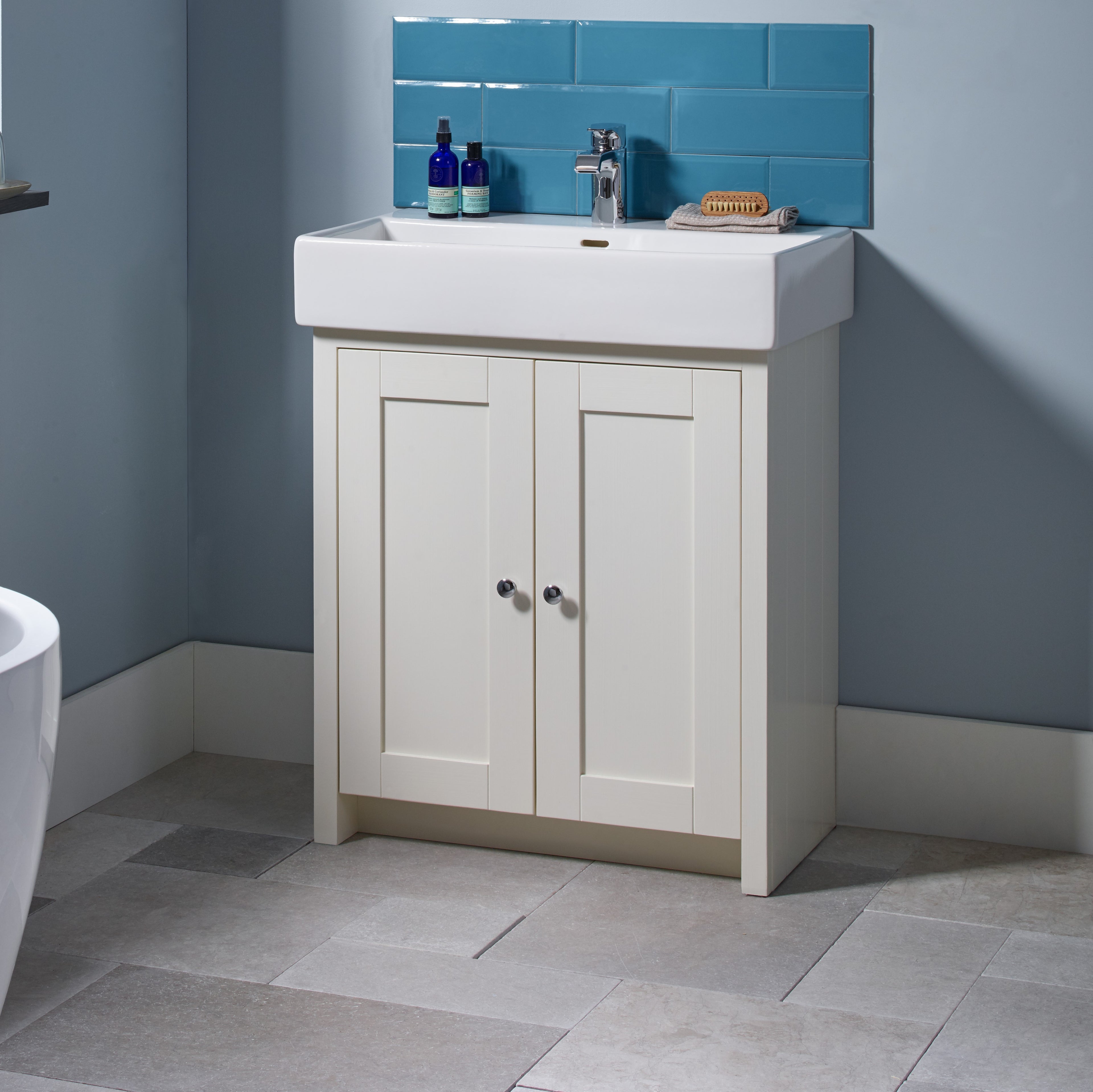 Tavistock Lansdown 700mm Freestanding Unit & Basin - Various Colours against small area of light blue tiling surrounded in blue paint