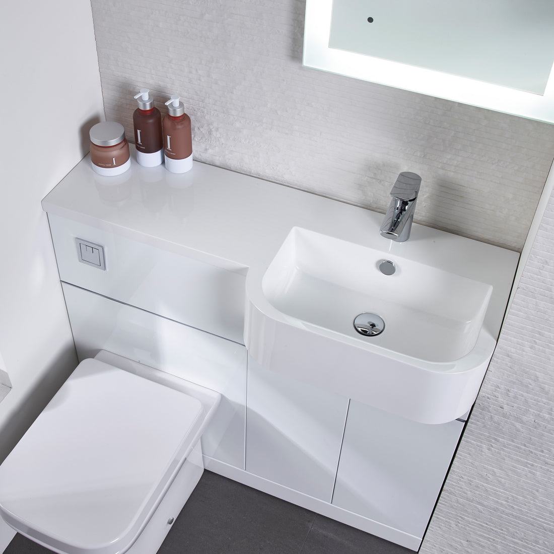 Tavistock Match 1000mm White Gloss Tavistock Match 1000mm Combination Unit - White Gloss (L or R Hand) against a white wall underneath a light up mirror MATRW