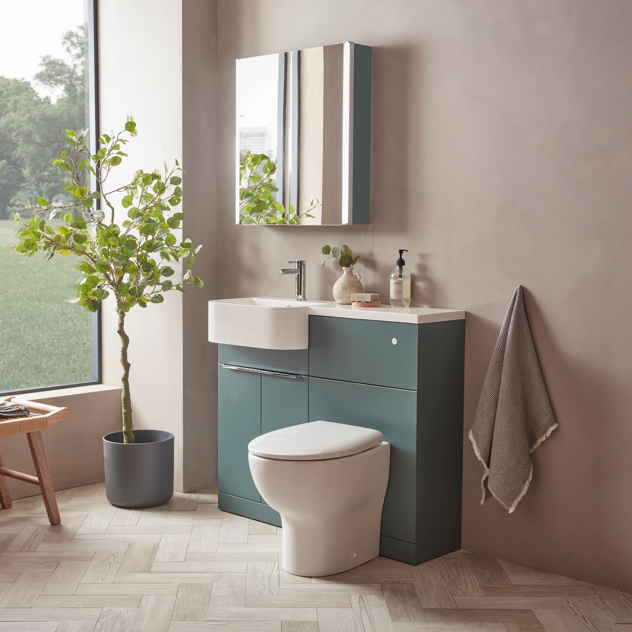 Tavistock Match 1200mm Combination Unit - Viridian Green (L or R Hand) against pal painted wall underneath a mirror MAT12LVRG