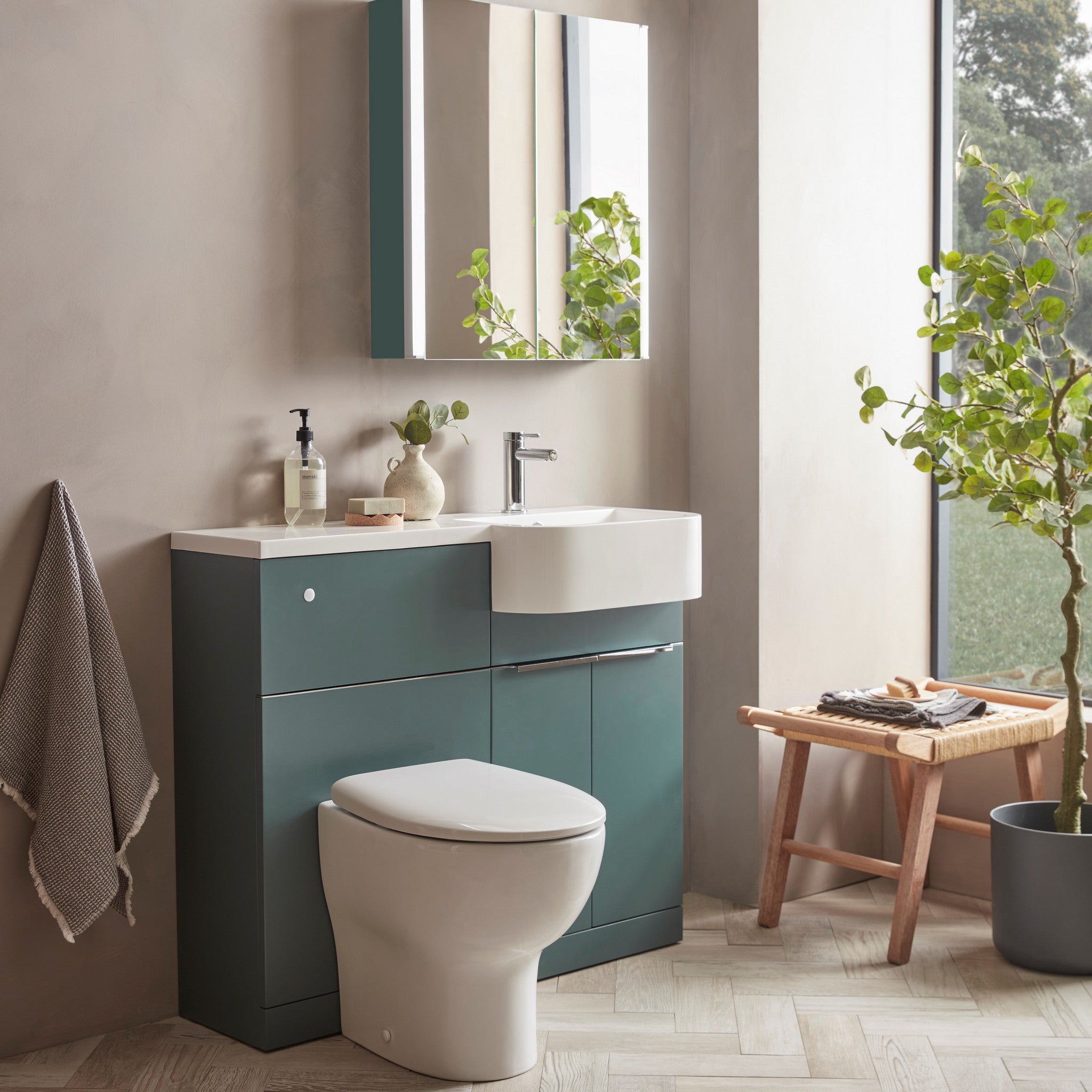 Tavistock Match 1200mm Combination Unit - Viridian Green (L or R Hand) against pal painted wall underneath a mirror MAT12RVRG