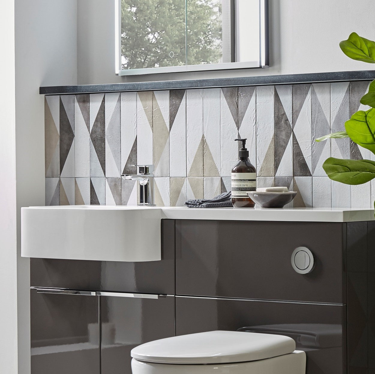 Tavistock Match 1000mm Combination Unit - Gloss Clay (L or R Hand) close up view against a tiled wall design MATRC