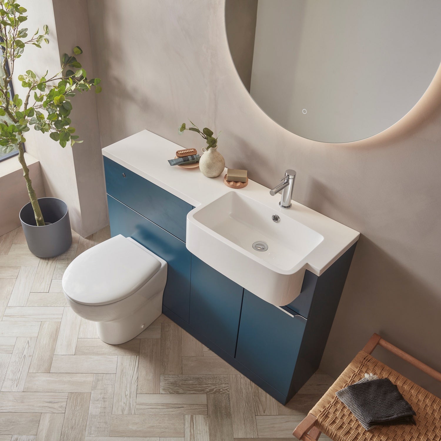 Tavistock Match 1200mm Combination Unit - Oxford Blue (L or R Hand) against pal painted wall underneath a light up mirror MAT12ROB