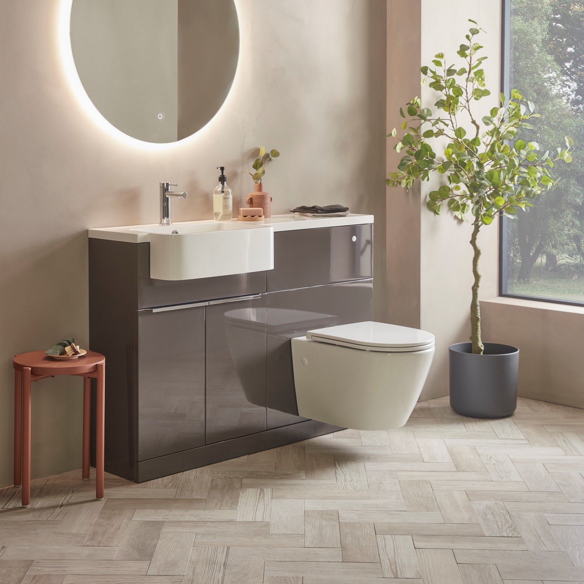 Tavistock Match 1200mm Combination Unit - Gloss Clay (L or R Hand) against pal wall underneath a light up mirror MAT12LC