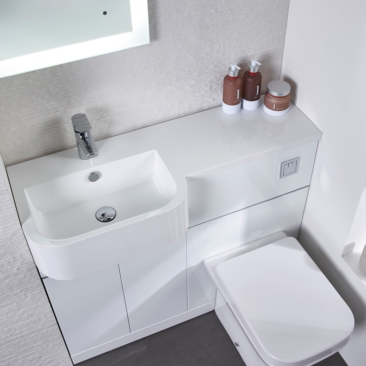 Tavistock Match 1000mm White Gloss Tavistock Match 1000mm Combination Unit - White Gloss (L or R Hand) against a white wall underneath a light up mirror MATLW