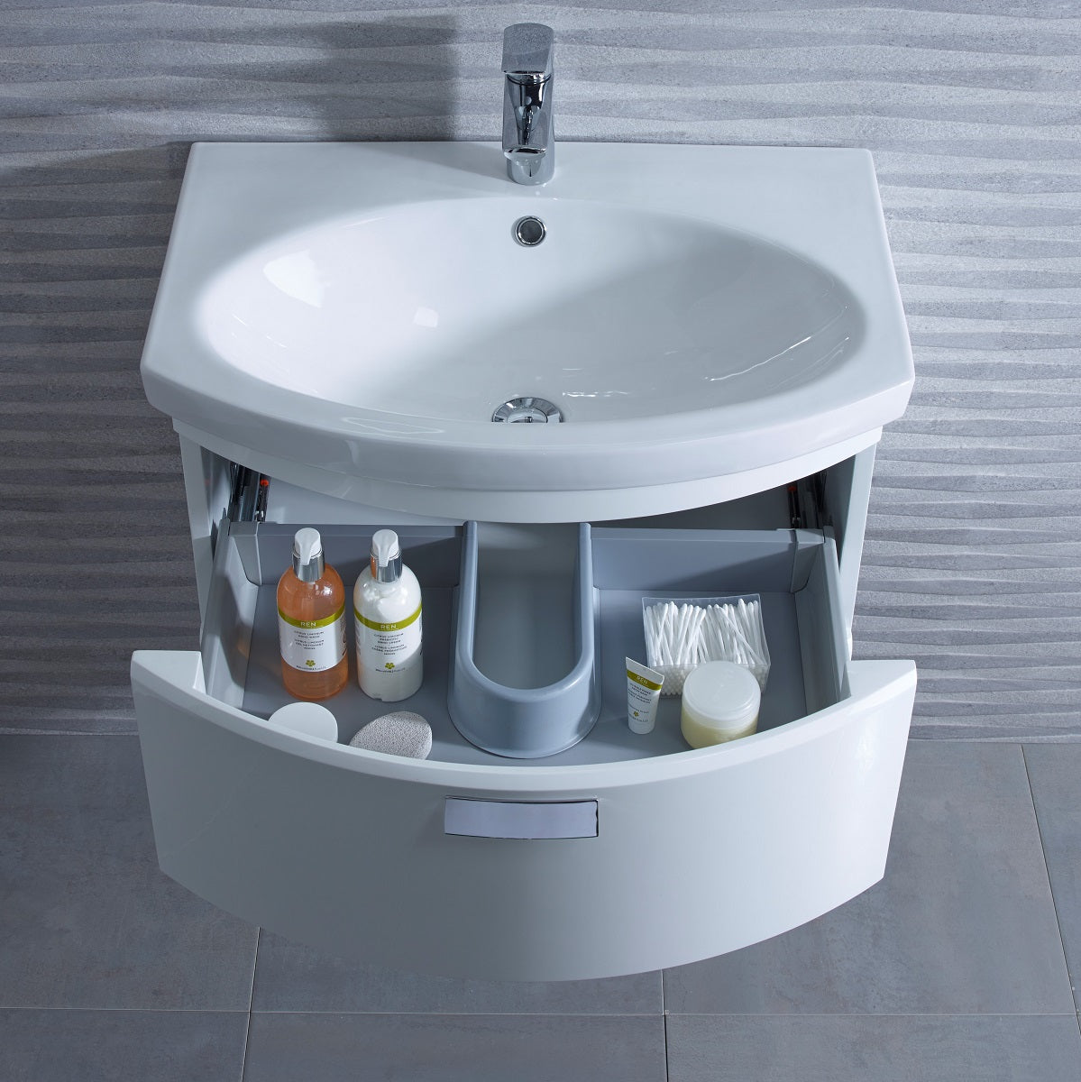 Tavistock Tempo 650mm Wall Mounted Unit & Basin - Various Colours basin open shown by top view with stone wall design against the unit TE650WW