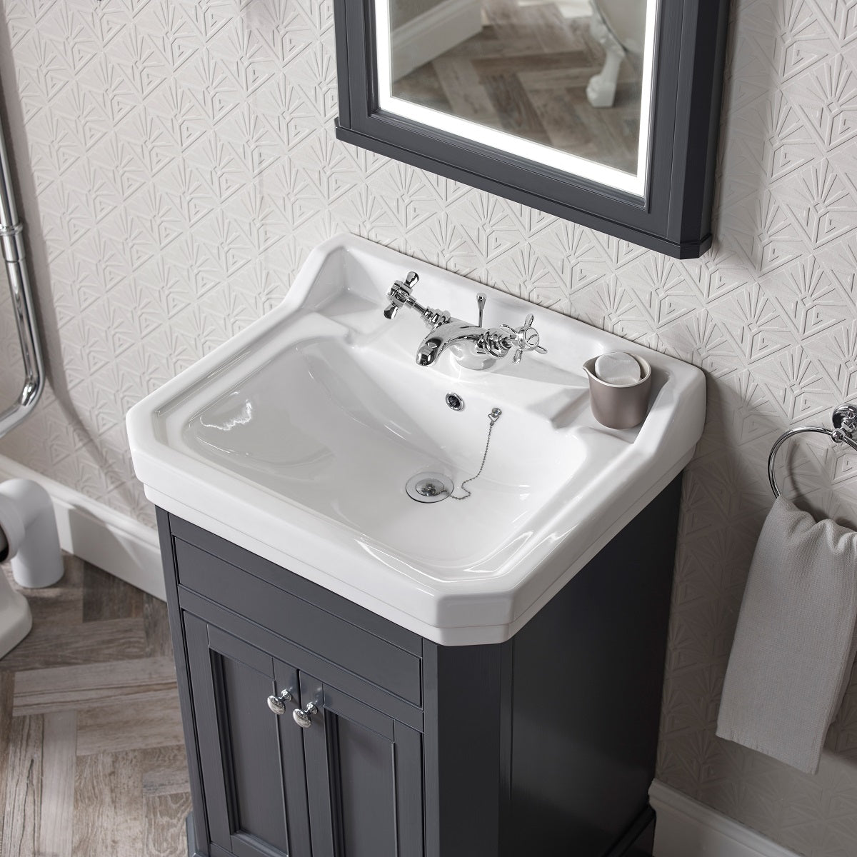 Tavistock Vitoria 600mm Floor-reaching Unit & Basin -Various Colours against white wallpaper underneath a mirror is marble blue VT60FMB