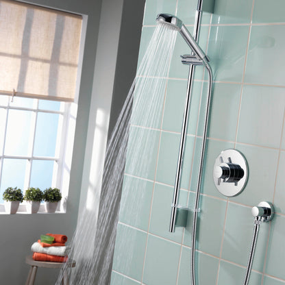 Aqualisa Aspire Mixer Shower with green wall tiles with water flowing ASP001CA