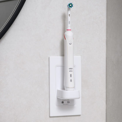 ProofVision In-Wall Single Electric Toothbrush Charger and Shaver Socket against white all next to a mirror PV12P