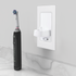 ProofVision In-Wall Single Electric Toothbrush Charger and Shaver Socket sitting on white stone countertop PV12P