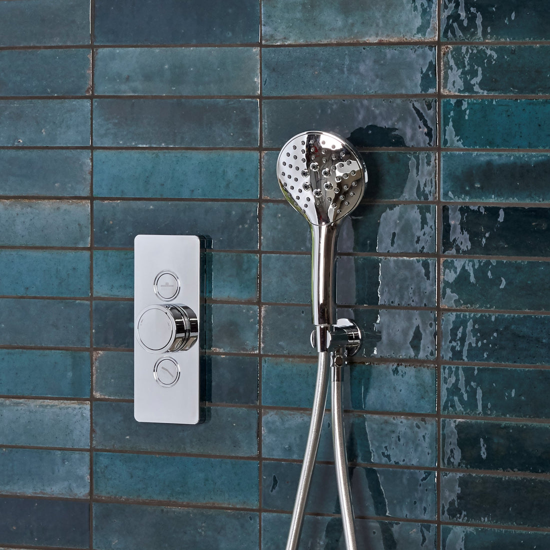 Tavistock Axiom Dual Function Push Button Shower System With Head And Outlet against blue tiling SAX2549