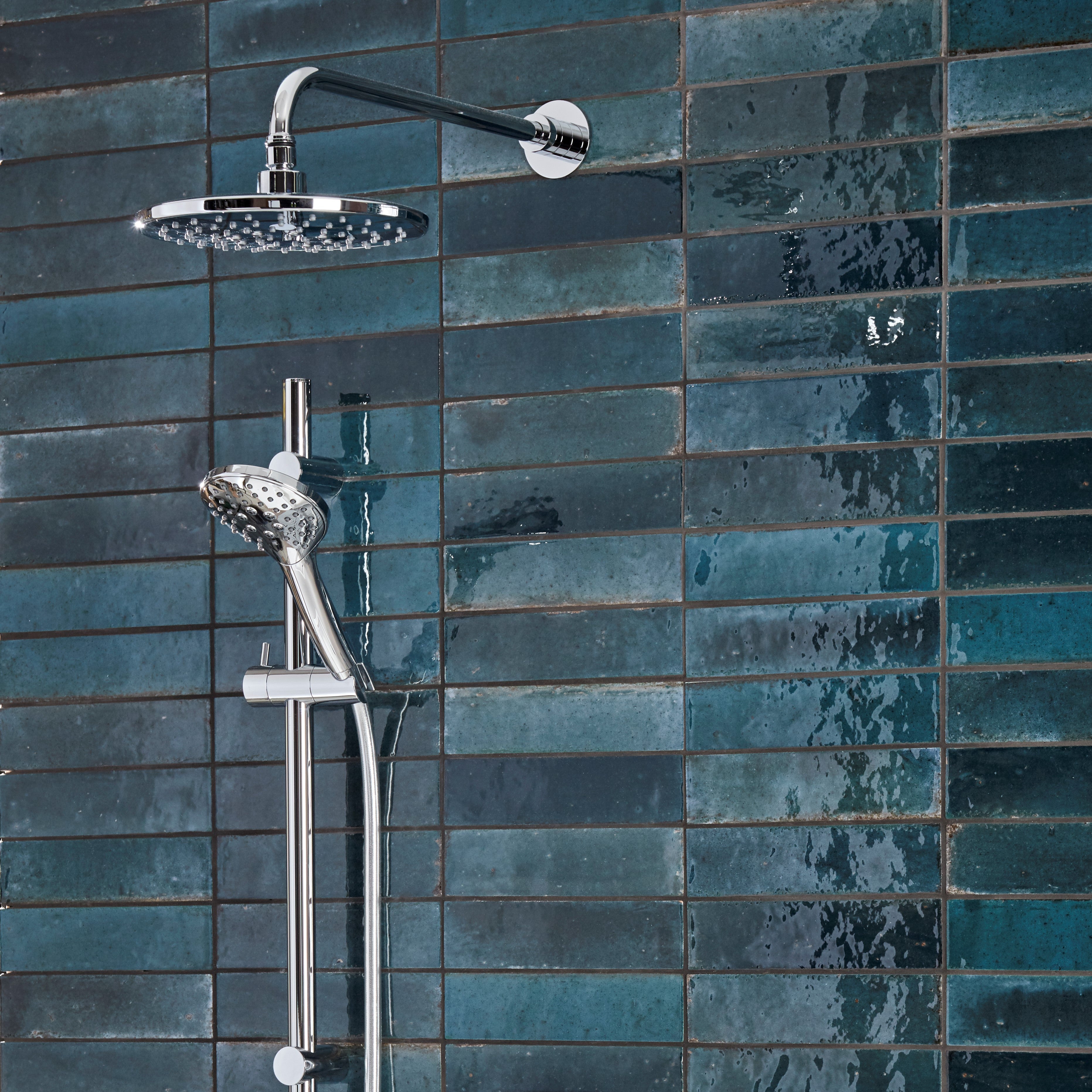 Tavistock Axiom Dual Function Push Button Shower System With Head And Riser Kit against blue tiling SAX2516