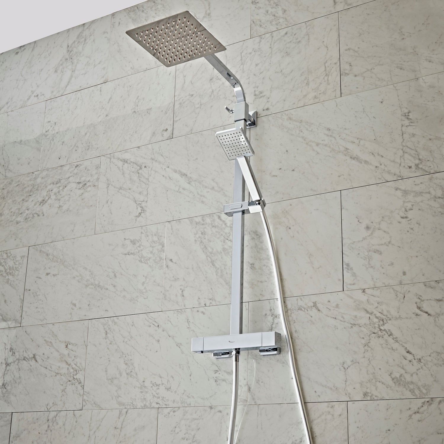 Tavistock Index Dual Function Concealed Shower System With Head And Riser Kit against light grey tiling SND1610