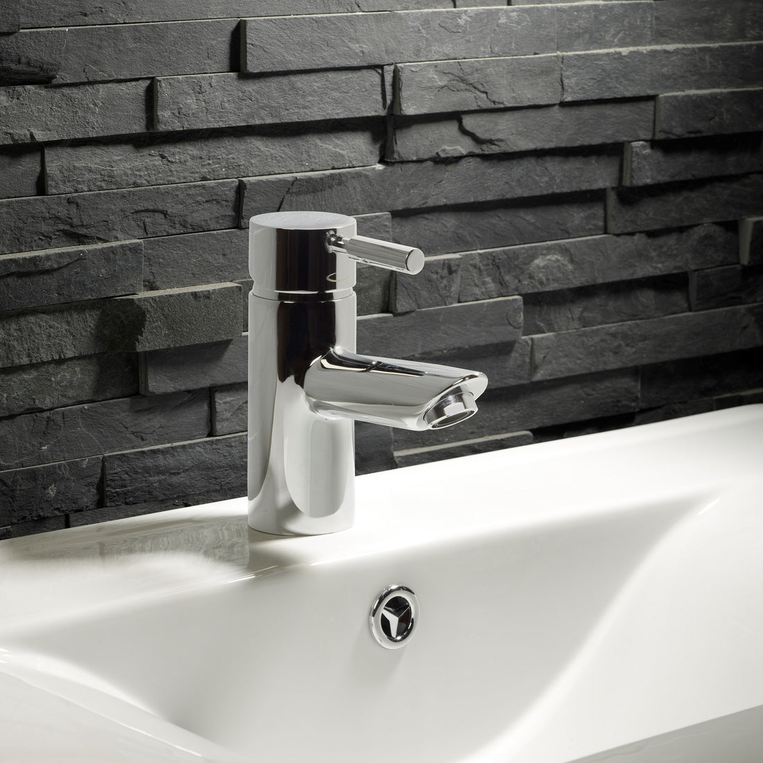 Tavistock Kinetic Mini Mixer Without Popup - Chrome against dark grey stone close up view TKN62