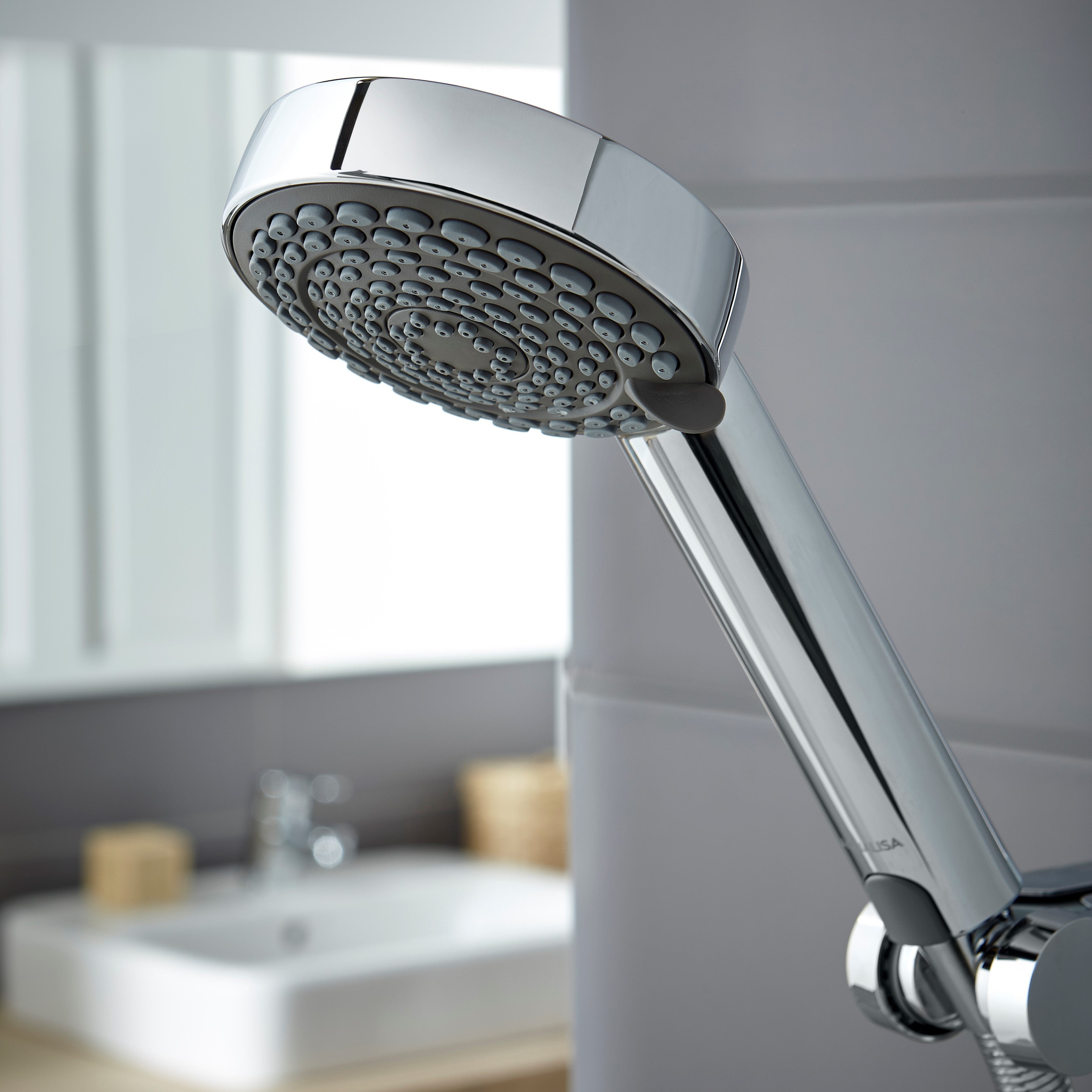 Aqualisa Lumi Electric 8.5Kw Shower With Adjustable Head against grey wall panels LME8501