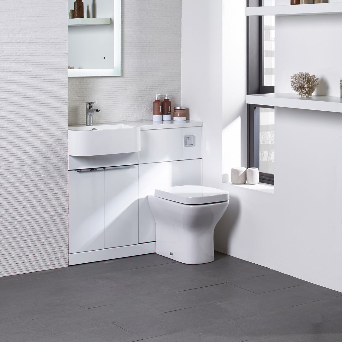 Tavistock Match 1200mm Combination Unit - White Gloss (L or R Hand) against white wall paper underneath light up mirror MAT12LW