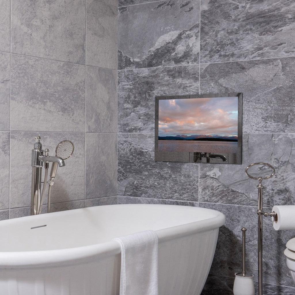 ProofVision 19inch Premium Bathroom Smart TV against stone wall including a bath tub PV19MF-A