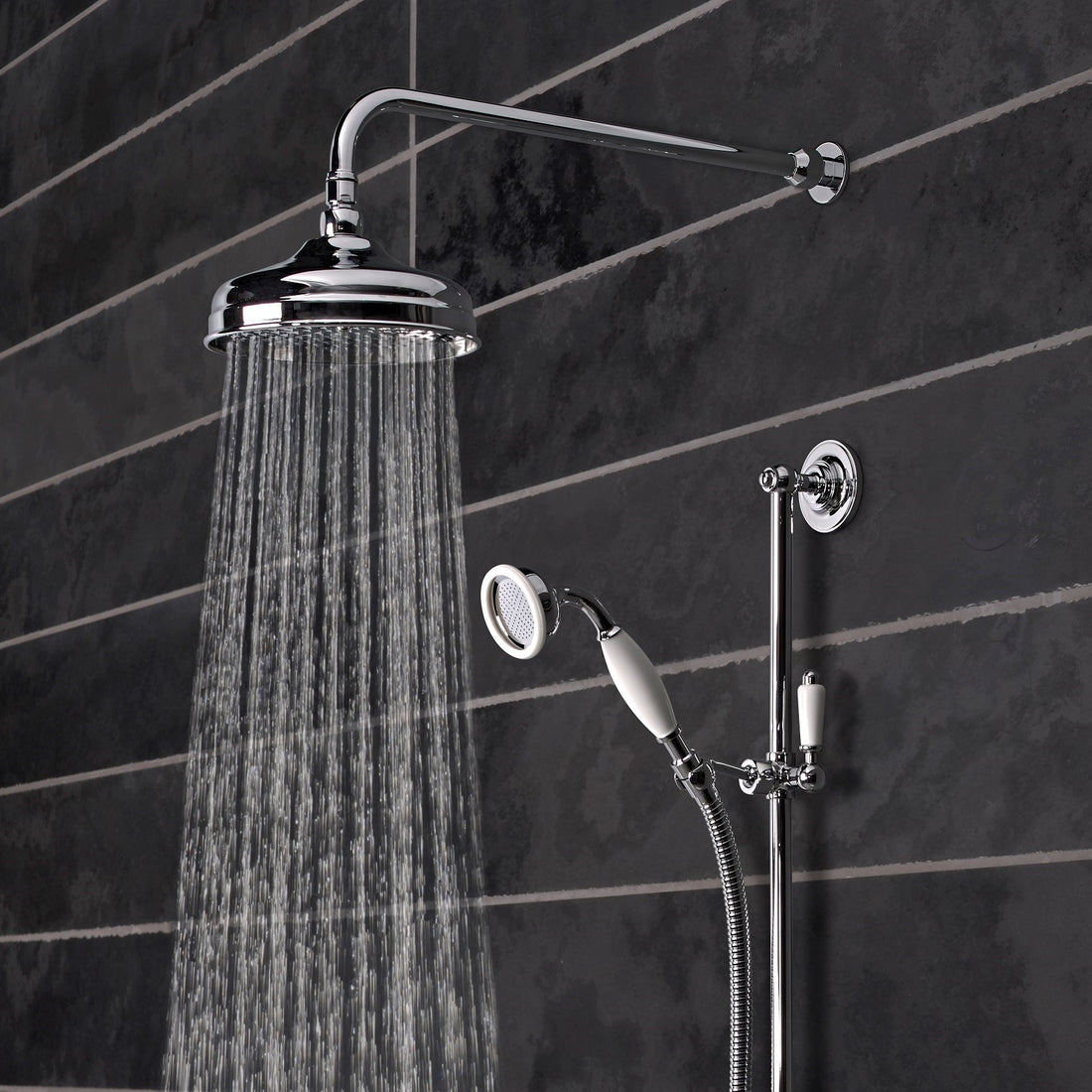 Tavistock Varsity Concealed Dual Function Diverter System - Chrome close up view of both shower heads against dark grey tiling SVA1615