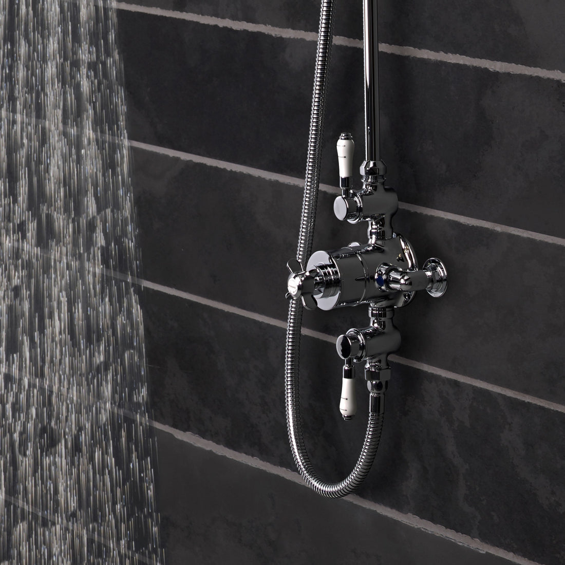 Tavistock Varsity Exposed Dual Function Shower System - Chrome close up view of the shower controls against grey tiling SVA1712