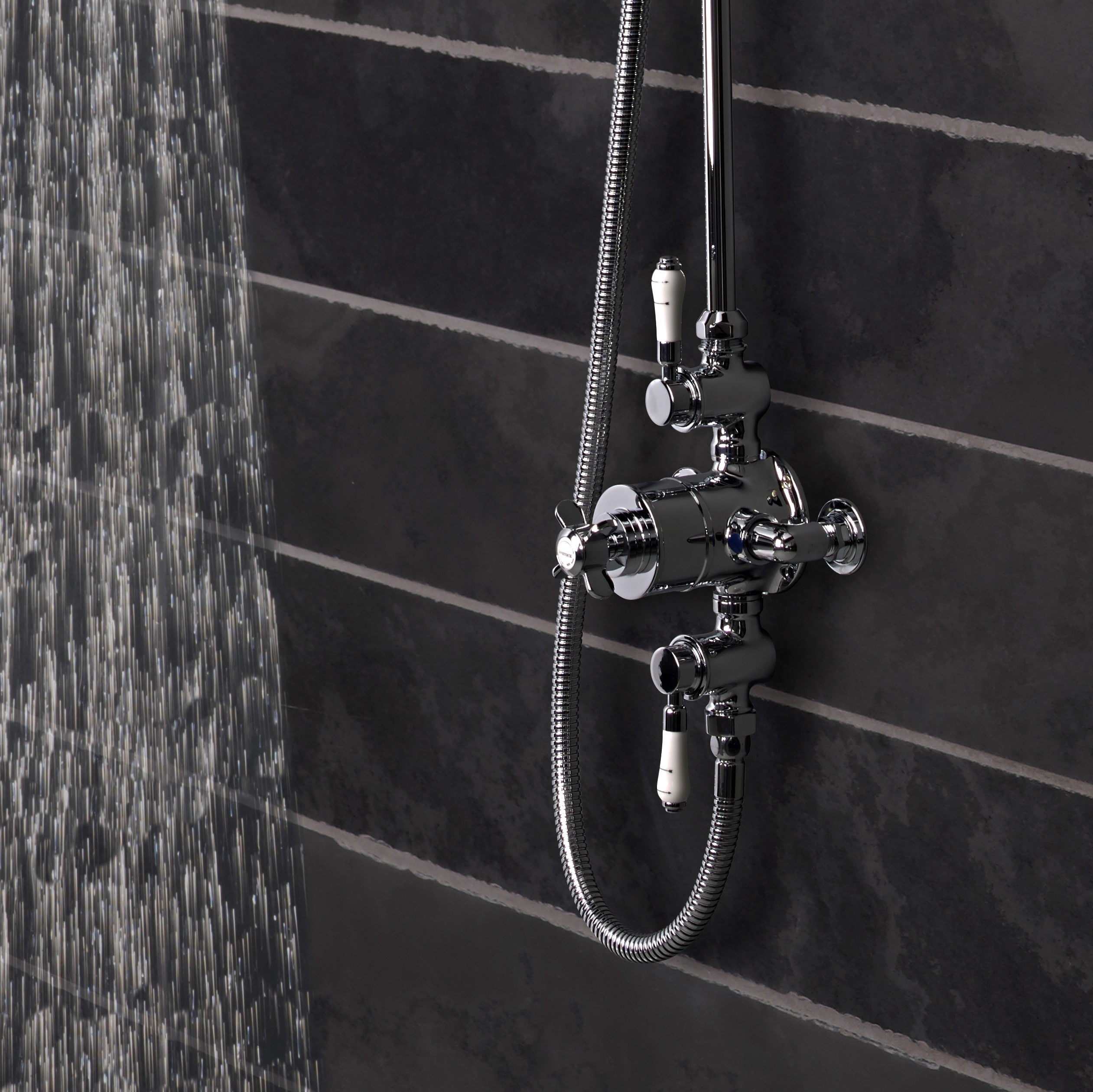 Tavistock Varsity Exposed Dual Function Shower System - Chrome close up view of the shower controls against grey tiling SVA1712