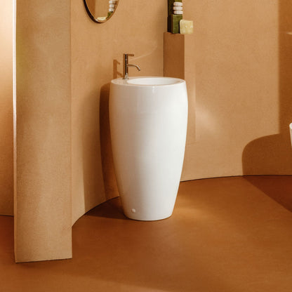 Laufen Ilbagnoalessi Freestanding Washbasin white against orange painted wall