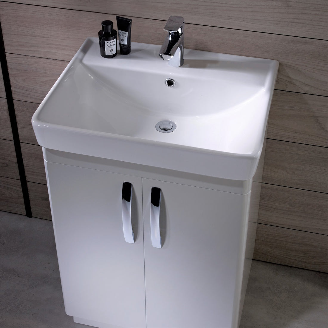 Tavistock Compass 500mm Floor reaching Unit & Basin - Various Colours against wooden wall background  CM500FW