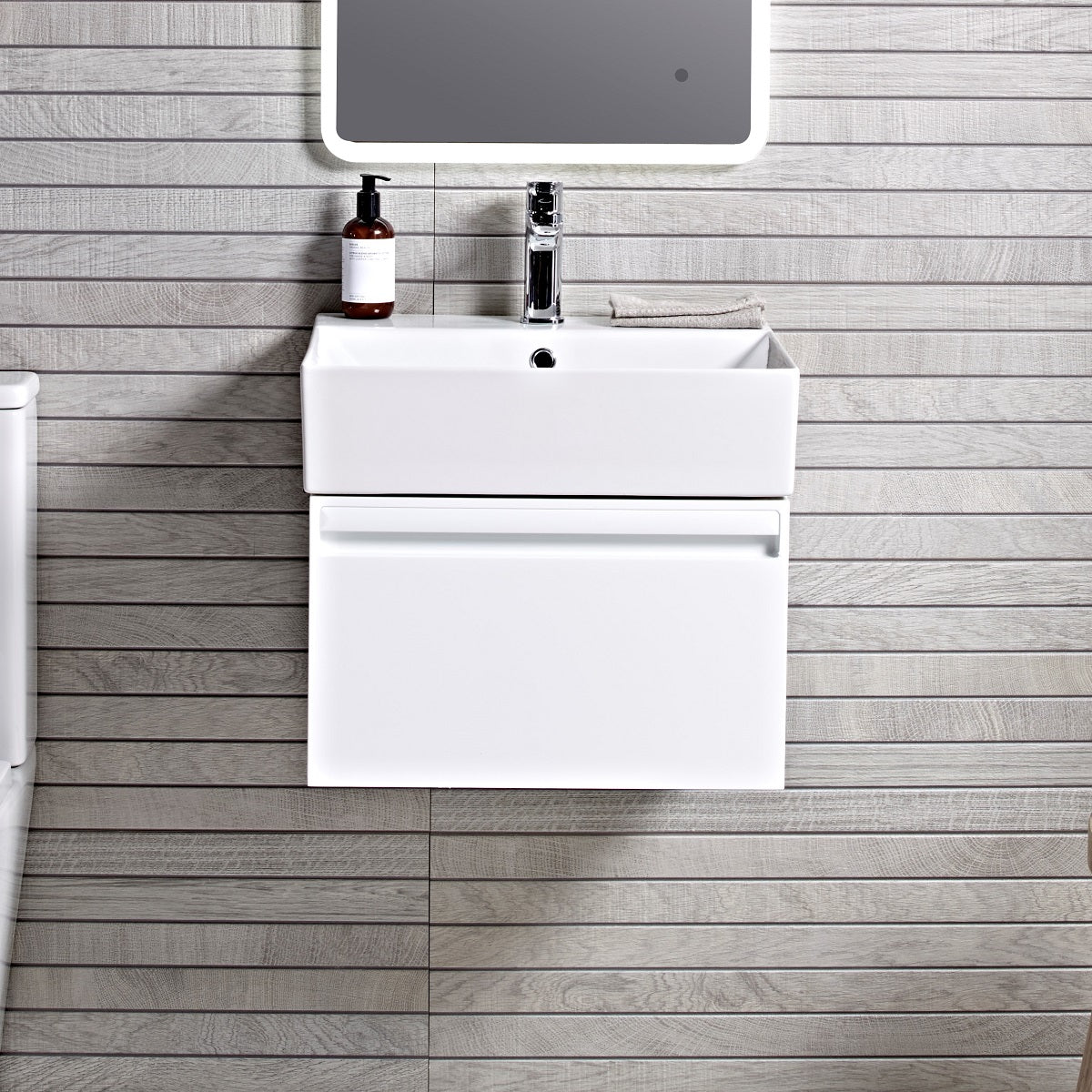 Tavistock Forum 500mm Wall Mounted Unit &amp; Basin - Various Colours wide view against wooden wall and mirror above unit/basin FR50WW