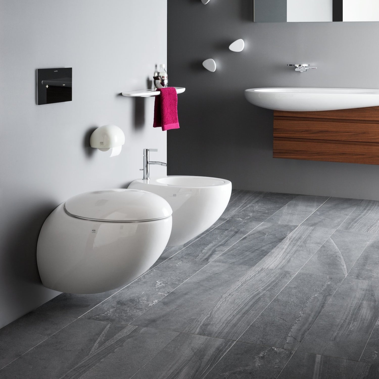 Laufen llbagnoalessi one wall-hung pan &amp; matching wall-hung bidet in bathroom setting. 