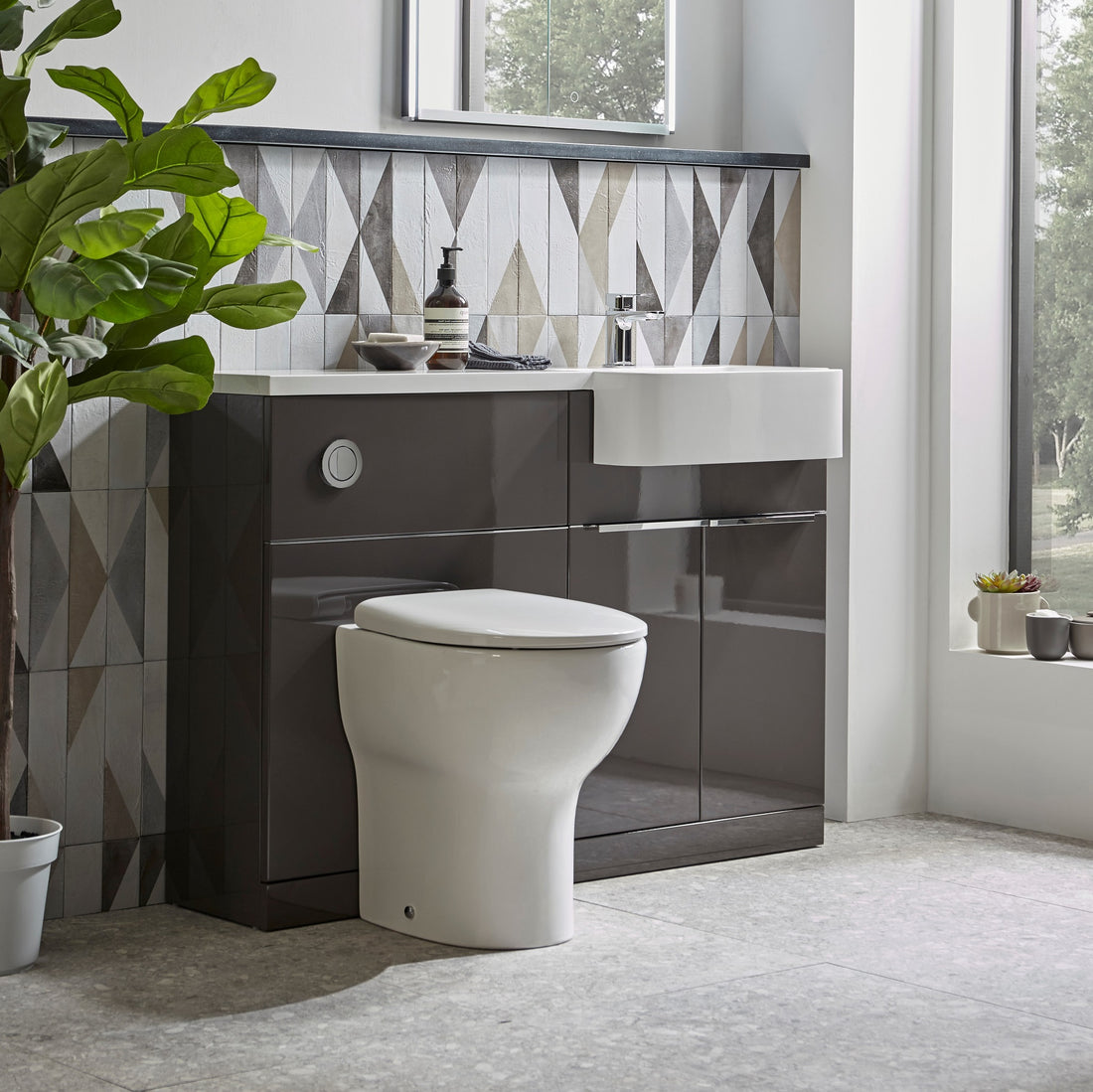 Tavistock Match 1000mm Combination Unit - Gloss Clay (L or R Hand) against tiled design plant fading off the left side MATLC