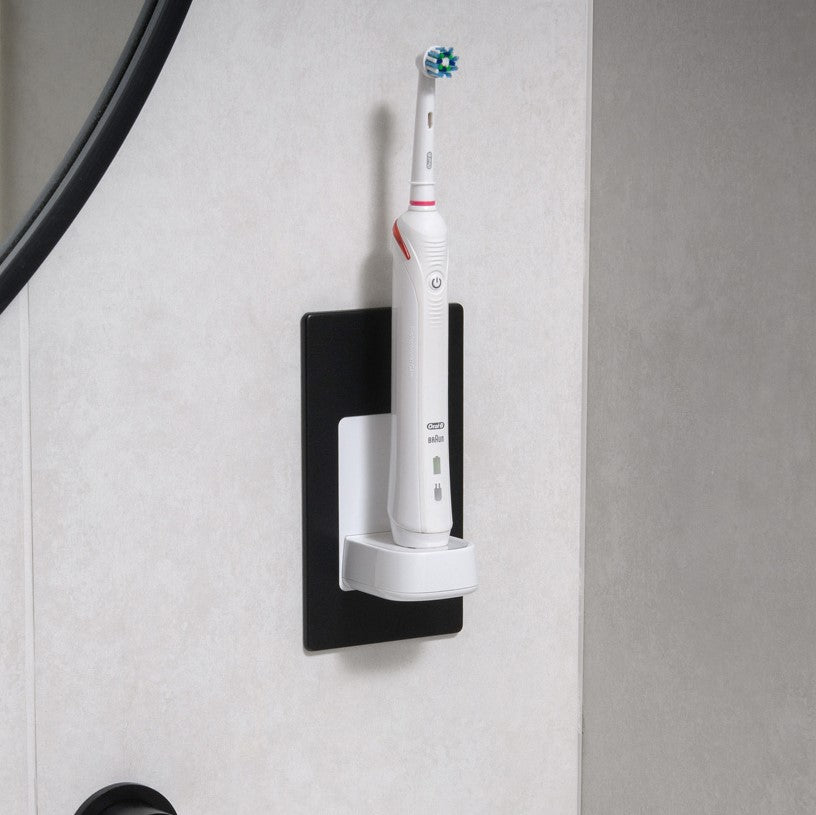 ProofVision In-Wall Electric Toothbrush Charger (Oral B &amp; Braun) against white wood tiles next to a mirror  PV10-B-FR