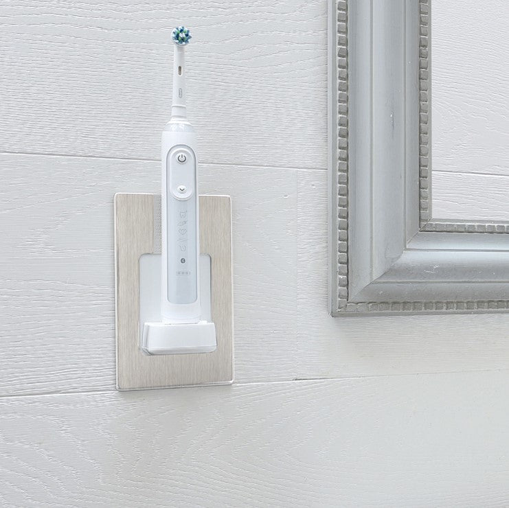 ProofVision In-Wall Electric Toothbrush Charger (Oral B &amp; Braun) against white wood tiles next to a mirror  PV10-BS-FR