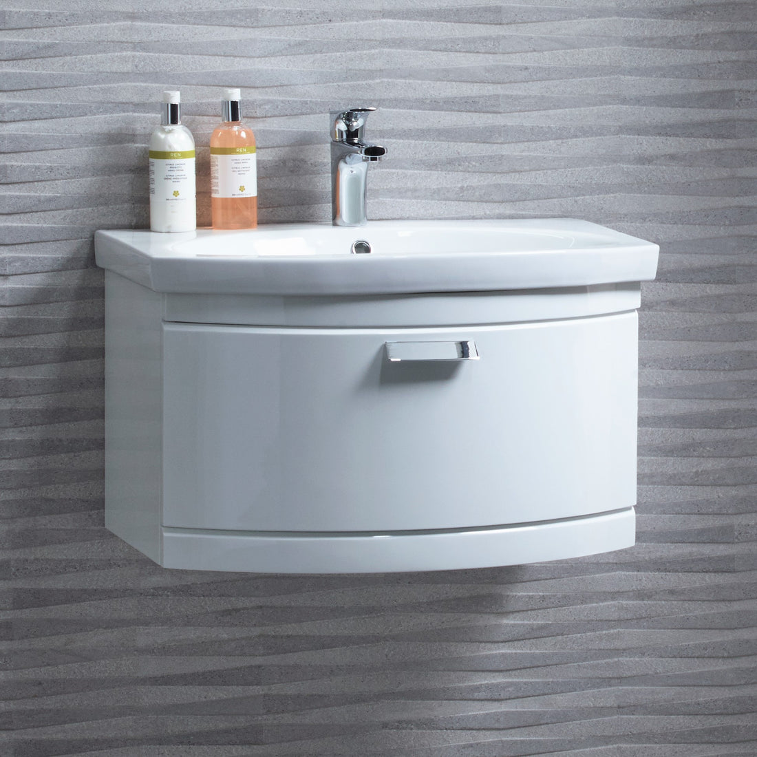 Tavistock Tempo 650mm Wall Mounted Unit &amp; Basin - Various Colours close up against a stone design wall TE650WW