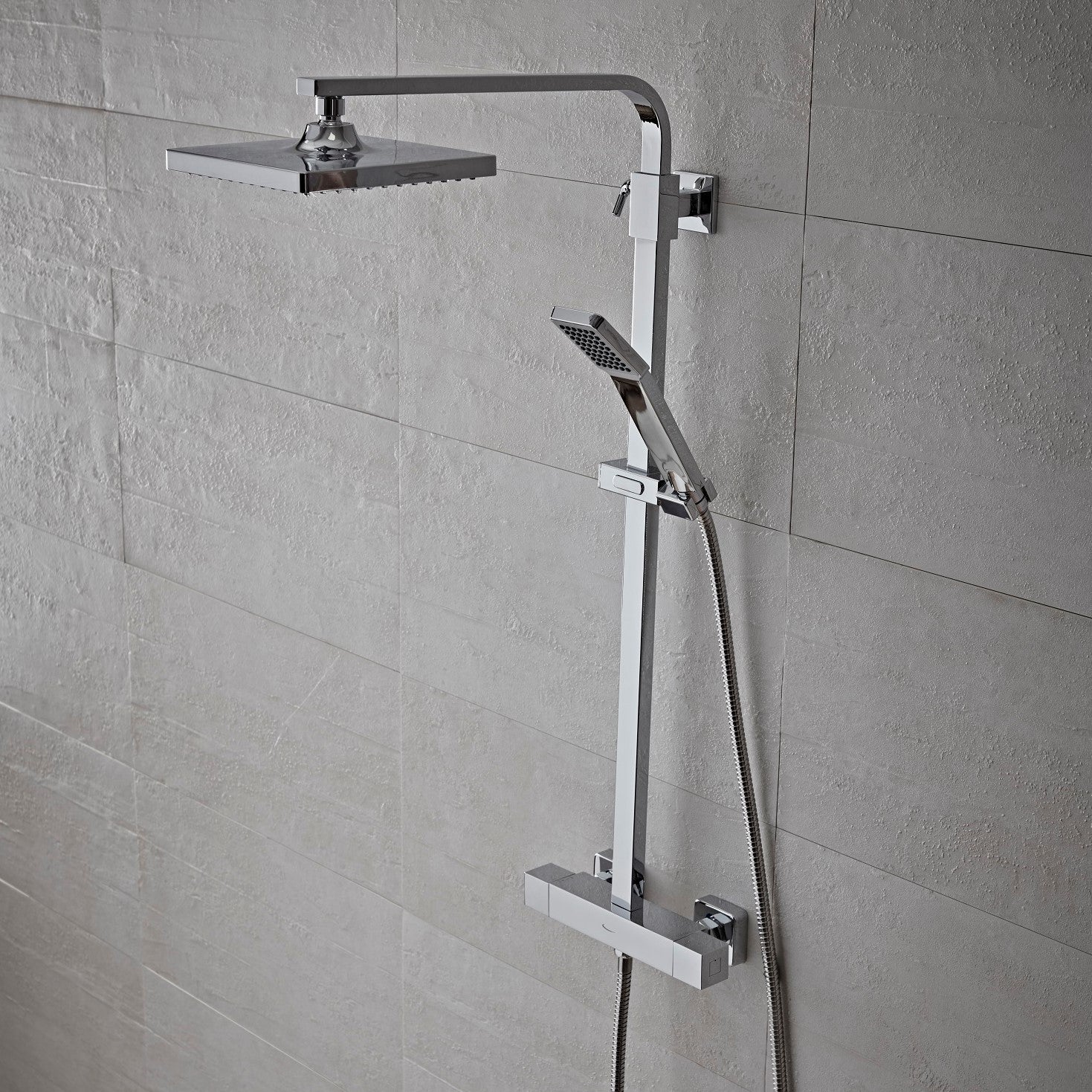 Tavistock Zone Square Exposed Bar Shower System with Fixed Head and Handset against grey tiling showing the full shower body SZN1508